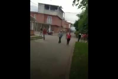 Colombian army is now shooting and throwing smoke grenades at people from Black Hawk helicopters.