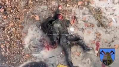 UA pov: Longer version of the "Boat Drop" video that shows a 2nd grenade being dropped on a Russian soldier with a bloody face. Warning: Extremely graphic!
