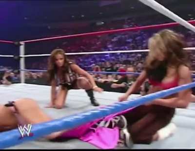 Melina strips Torrie Wilson and leaves the Has-Been flailing around in her black bra and pink panties.