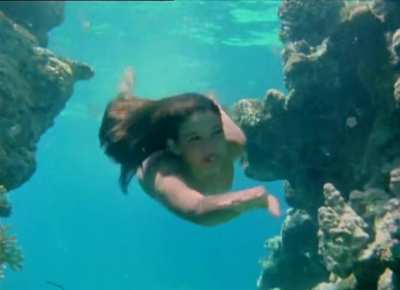 Phoebe Cates swimming underwater