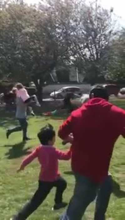 Dads racing while carrying their kids......