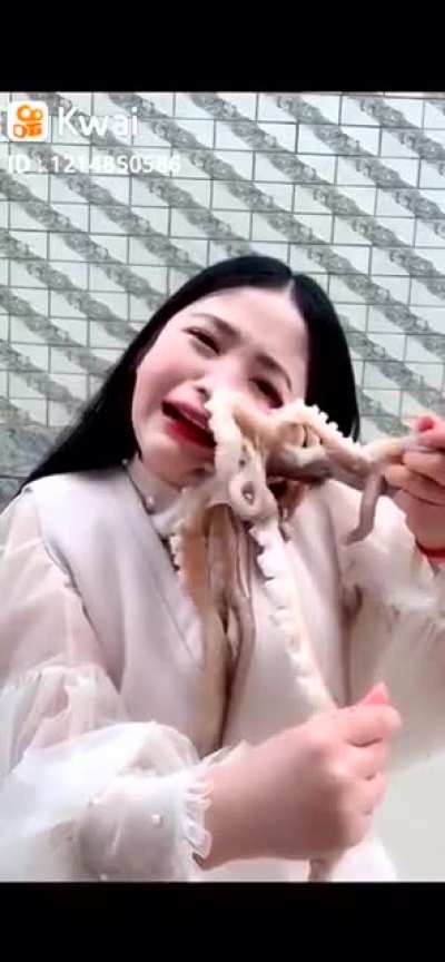 Trying to eat a octopus raw