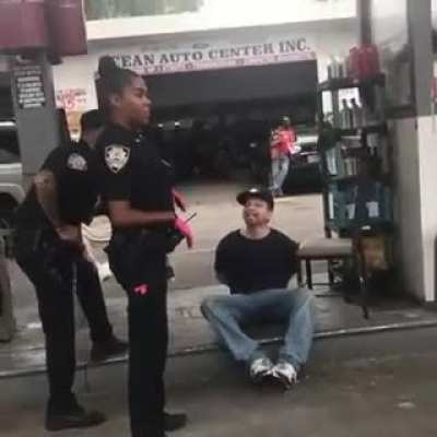 This guy trying to offend the police officer by repeatedly calling her the n word