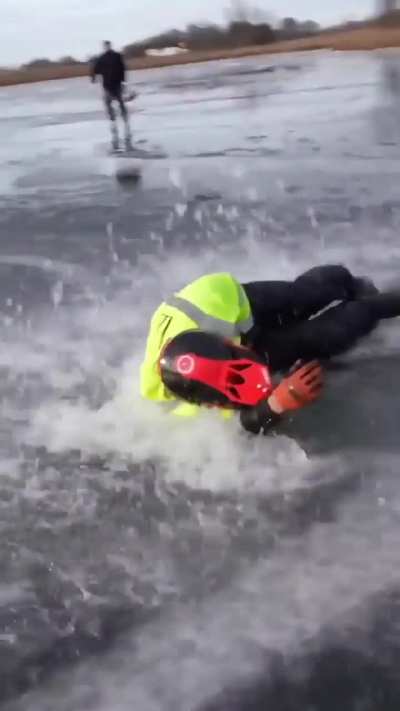 Riding a bike on thin sheet of ice 
