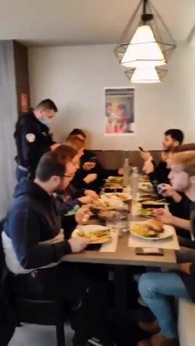 "The New Normal" in France. Police officers are on the hunt, checking papers to verify compliance and cutting down on the unvaccinated who dare to dine.