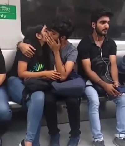 Delhi metro scenes : One couple giving pure oxygen into each other to fight pollution.