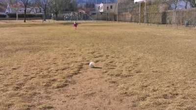 My girl does a 50 meter run-up to kick a ball