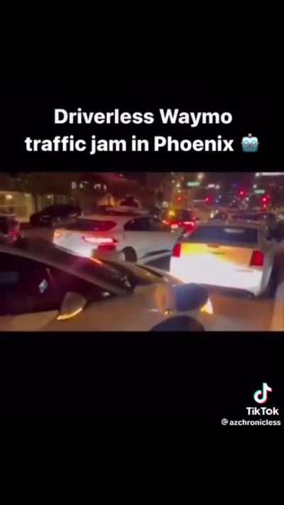 Waymo robots on the loose causing a traffic jam.