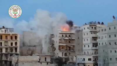 FSA 16th Division "Hell Cannon" strike on a sandbagged Syrian Army rooftop position - Ashrafieh, Aleppo - 5/10/2014