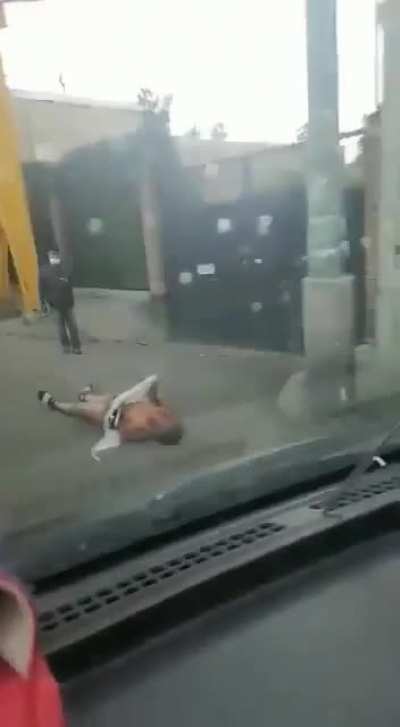 Alternative view of the robber after getting thrown away from the bus