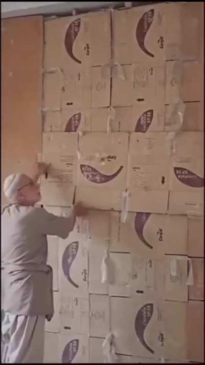 After 15 years, a Syrian man breaks down a wall to retrieve his library, which he hid to protect the books.