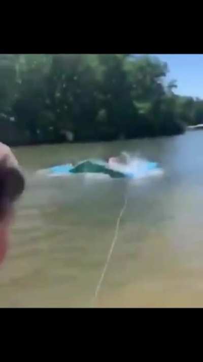 A young courageous man saving people&rsquo;s lives from a snake.