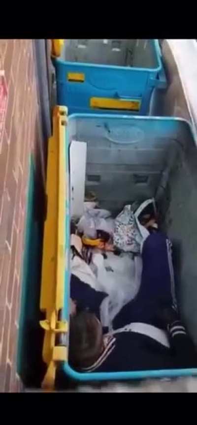 Some bloke lying in a bin talking to himself after doing pills &amp;amp; powder