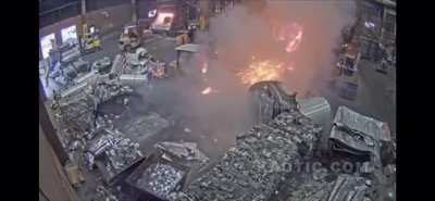 Extremely lucky forklift driver avoids molten metal bath. The cab and the mast protected him.