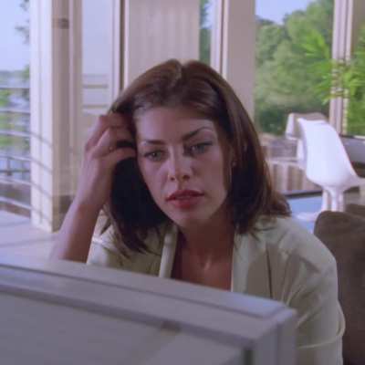 Shae Marks and her (literally) unreal cans in "Return To Savage Beach" (1998)
