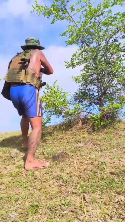 Unicorn Guerrilla Force fighter letting off shots from his AK.