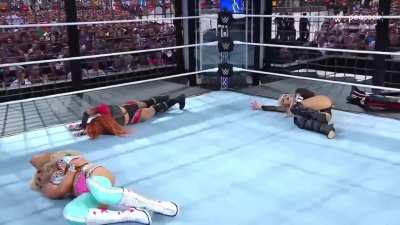 Liv Morgan accidentally caught low by Becky Lynch