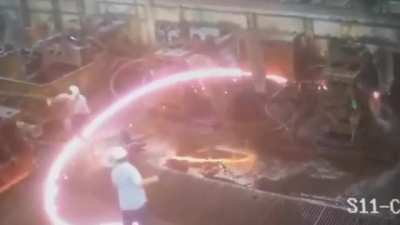 Worker adjusting rolling mill gets struck by cobbling steel bar. Video date August 2020 (reposted due to recent interest)