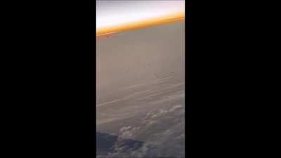 What are we seeing here? "Airplane passenger captured on video a fleet of UFOs as it flew over New York"