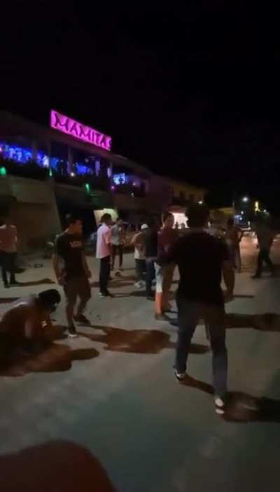 Latin America street fight with cumbia music &amp;amp; Spanish soccer announcer.