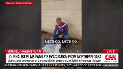 CNN Report. A Palestinian father in Gaza follows Israeli occupation forces&rsquo; instructions and leaves his home holding a white flag. His son, who&rsquo;s coming with him, is shot in the head by the Israeli forces.