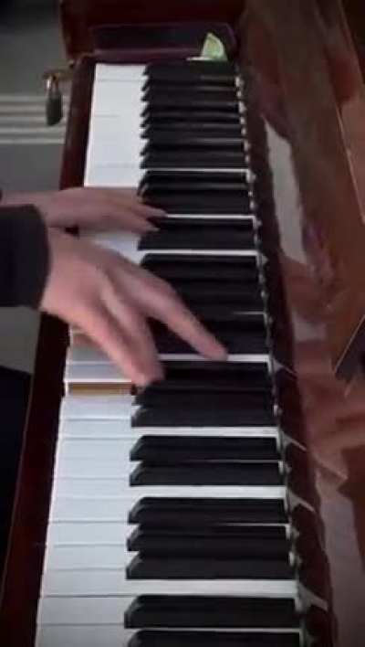 When the air raid warnings began, everyone was asked to move into the railway station. Alex refused to stop playing the piano, defiantly playing louder against the bomb sirens.