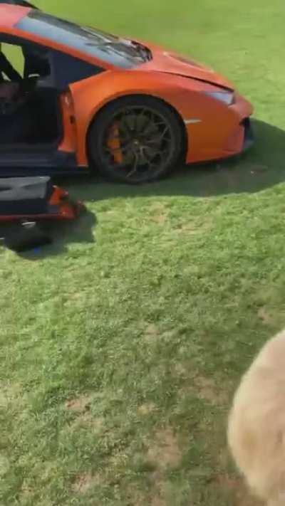 Poor boy didn't know how to open a Lambo door