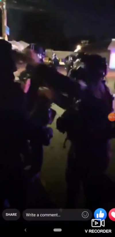 Portland Police Officer rips off the mask of a peaceful protester and pepper sprays them. 7/13/2020