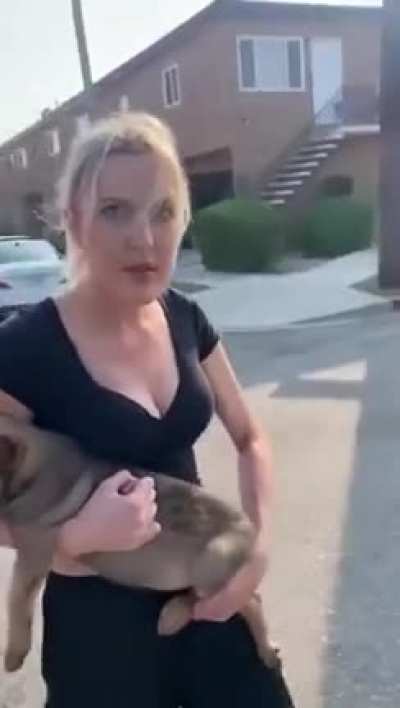 Deranged woman harasses man and throws puppy at him