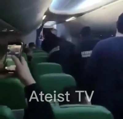 Passenger screams &lsquo;Allahu akbar&rsquo; as he is dragged off Paris-Tunisia flight that was forced to divert when he was violent towards crew who stopped him praying by the cockpit