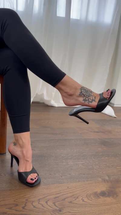 Temptation at its finest - dangling my high heels mules for your pleasure. [F]