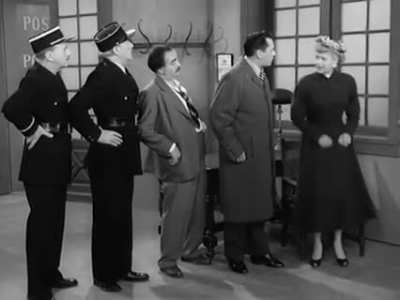 Lucille Ball gets in trouble with the authorities while in Paris, during a 1956 episode of "I Love Lucy". To translate they get an French officer who knows German, and a German drunk who knows Spanish... so Desi Arnez can tell Lucy in English.