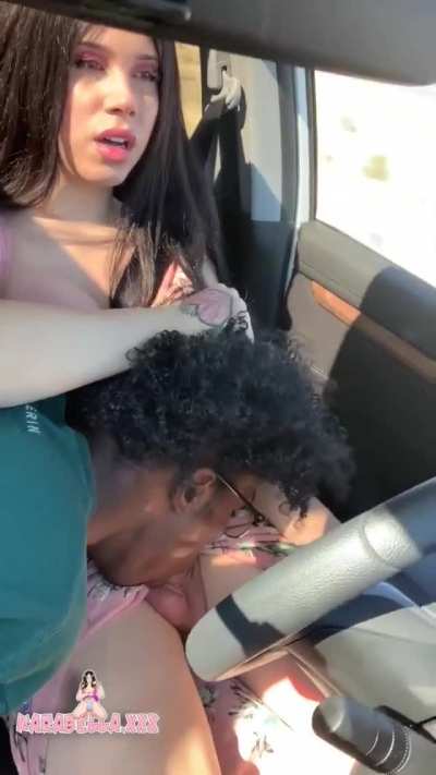 Karabella gets a blowjob while driving her car (gif)