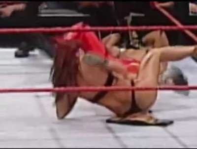 Lita gets ragdolled and stripped of her clothes
