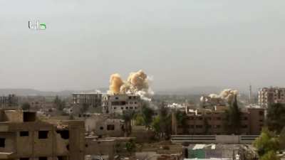 Syrian Army helicopter drops four dumb bombs on to Daraya - October 2015