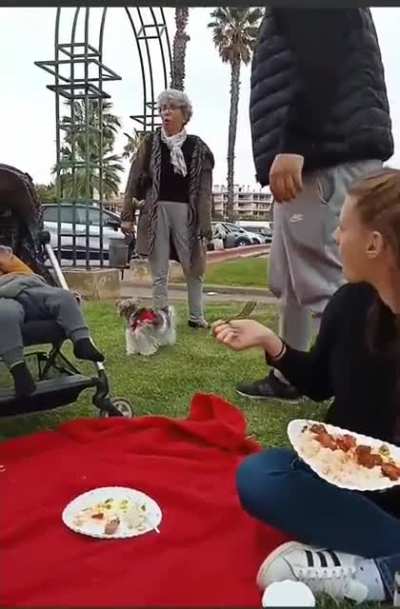 Old woman throws racist/xenophobic remarks at a family eating in a french park