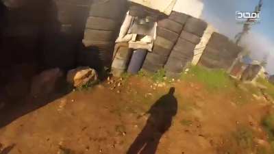 This could be a scene from a FPS game - he finds LMG uses it as a pickup weapon. Abu Baker Army in Alrasheden Aleppo. April 2019