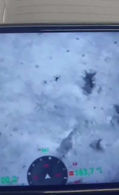 A Ukrainian hexacopter equipped with a machine gun fires at Russian positions, footage from an enemy UAV