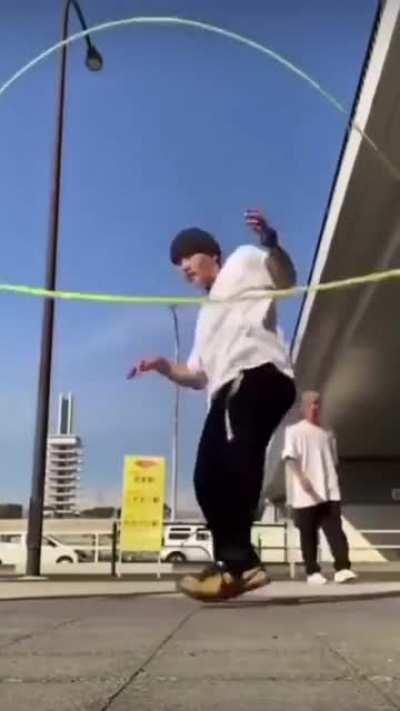 Man jumps through strings in perfect time with melody