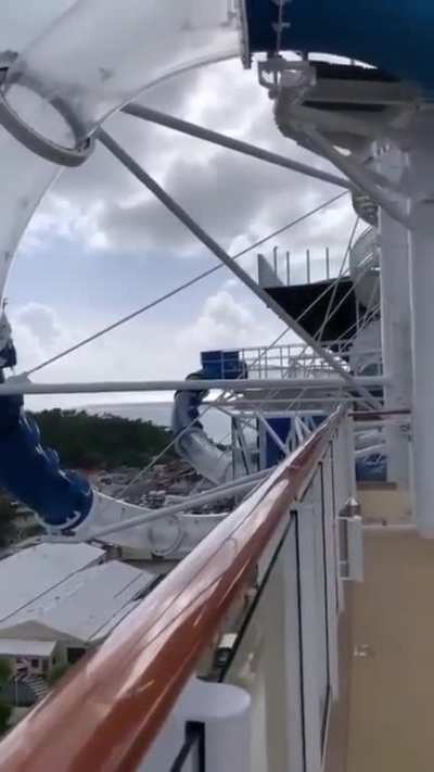 Man needs more speed on a water slide.