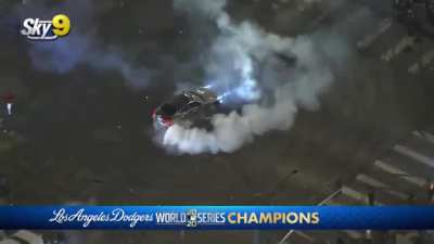 Guy does donuts over active fireworks, setting his car on fire