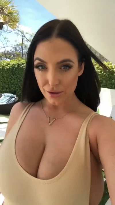 Angela walks for us again. Her top can hardly hold her breasts in.