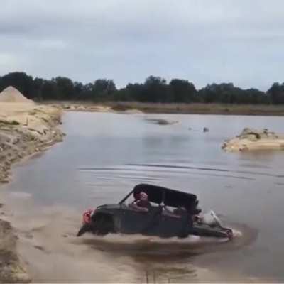 WCGW driving into a water hole in a quarry