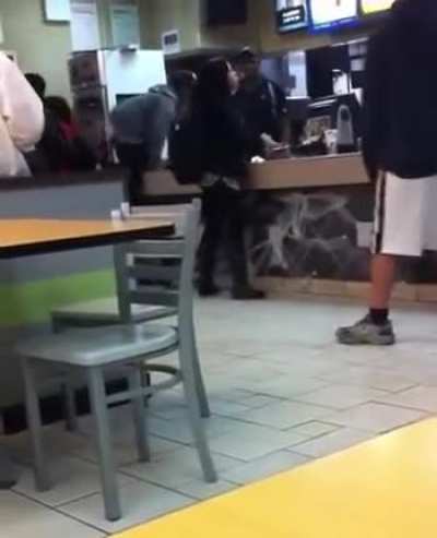 McDonald's cashier in Greenwich hits two customers with a stick after they slap him and jump the counter.
