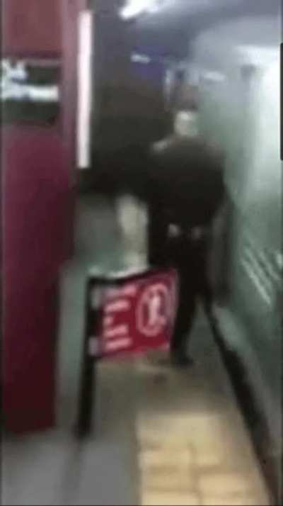 Man walks through a "do not enter" sign
