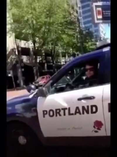 Girl asks Portland PD for help because guys are shooting people with paintball/airsoft gun from the top of a building as well as bear macing people. Cop: &ldquo;There&rsquo;s nothing I can do about that right now.&rdquo;