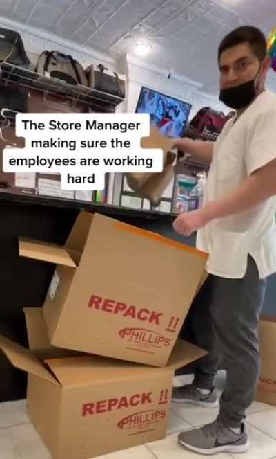 Store manager making sure the employees are working hard.