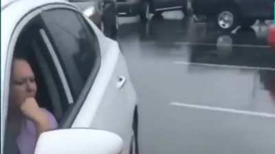 Woman blocks in and calls 911 on another car for having expired tags