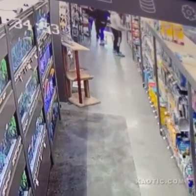 Dallas Man smelling a pet store customers behind.
