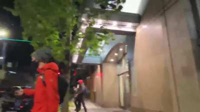 Seattle BLM block the exit to a parking garage, the driver moves forward, and they continue to stand in front of the car, trying to push him backwards before they're pushed out of the way